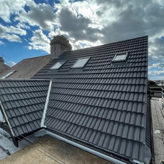 Complete roof replacement with Velux skylights